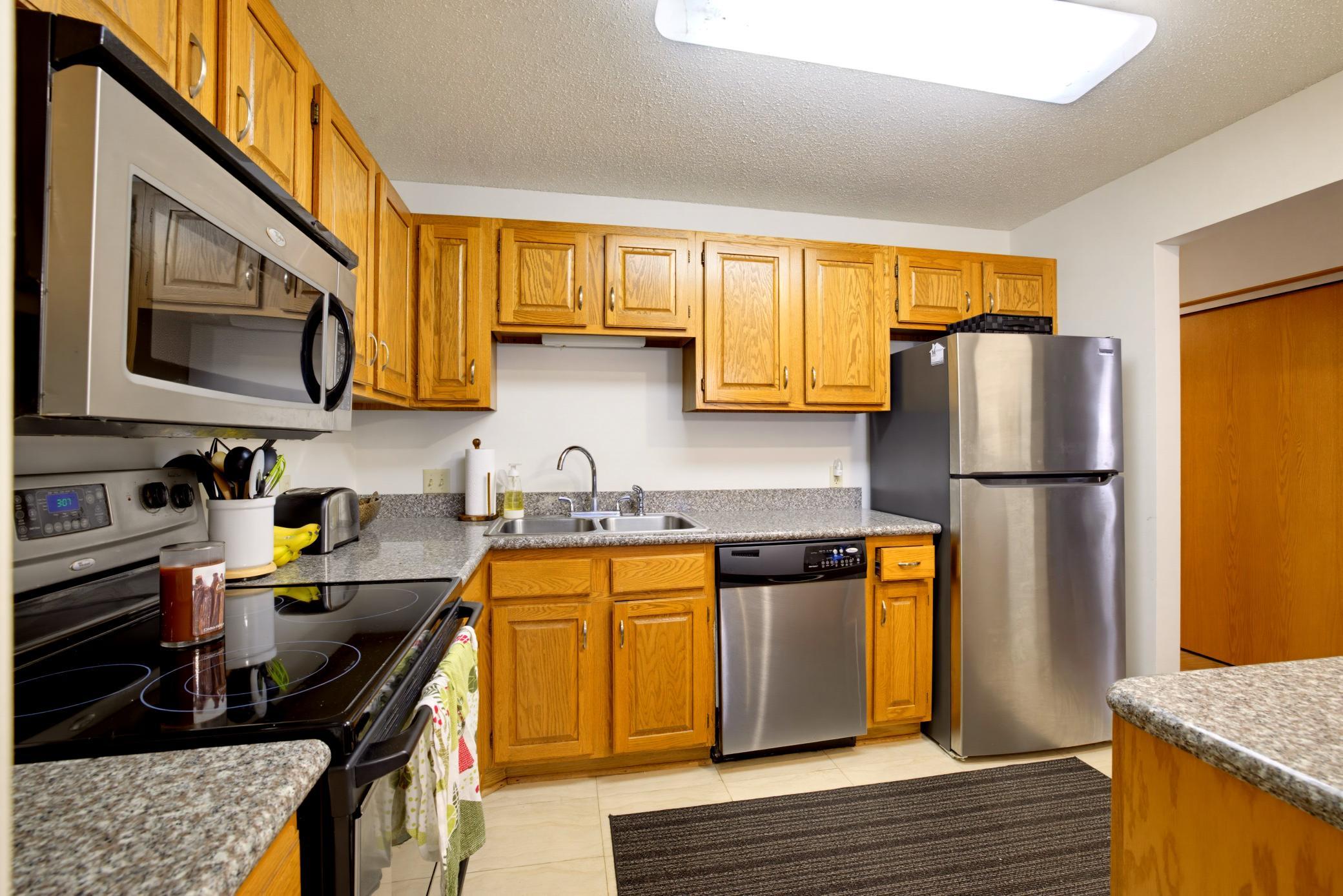 Listing Photo 1 - Condo for sale in building located at 7200 Cahill Rd, Edina, MN 55439 - Unit #106