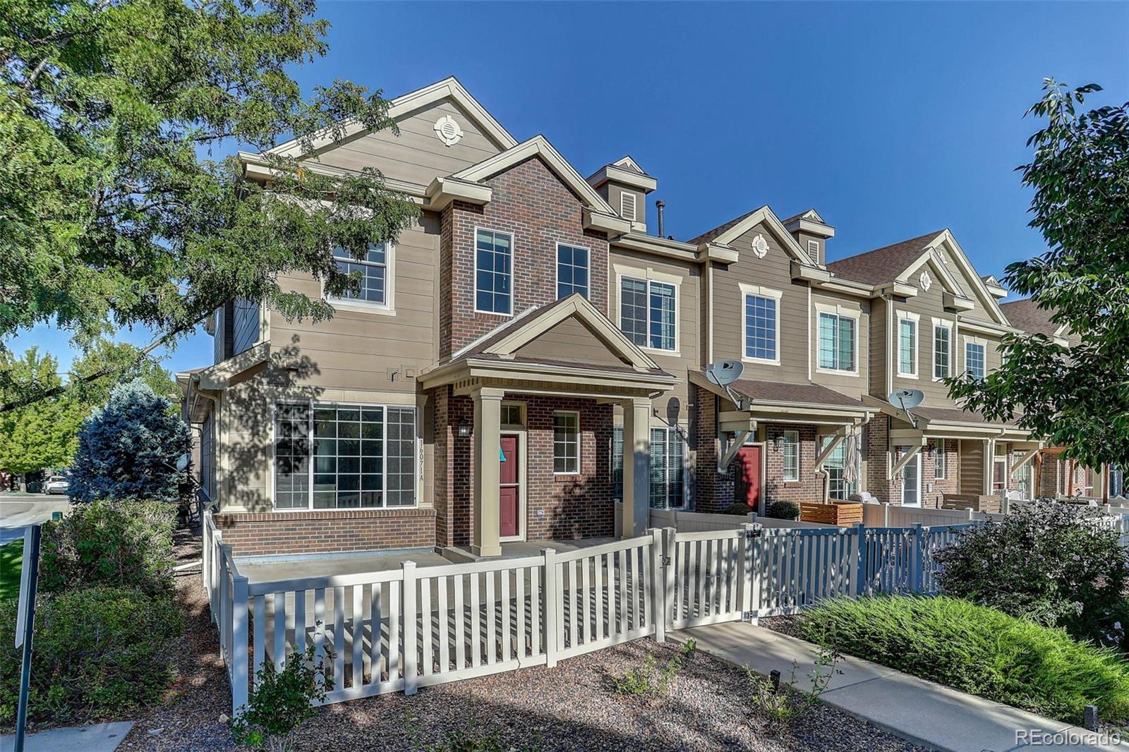 Listing Photo 1 - Condo for sale in building located at 16071 W 63rd Ln, Arvada, CO 80403 - Unit #A