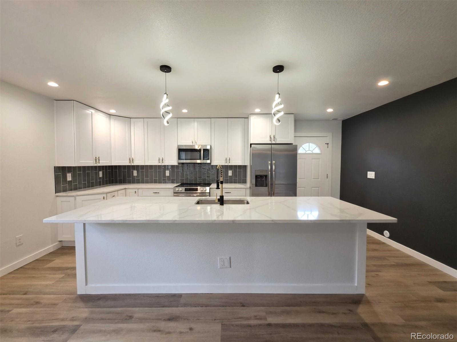 Photo 3 of Single family home for sale at 810 Uvalda St, Aurora, CO 80011 | MLS# 7241564 | Listing updated on 2026-10-23